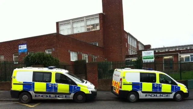 Police cars outside Four Dwellings High School