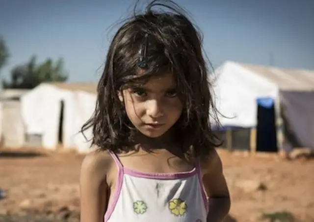 Refugee child in a camp