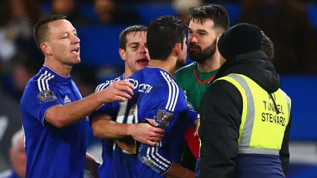 Diego Costa (3rd R) of Chelsea squares off with Boaz Myhill (2nd R) of West Bromwich Albion after the final whistle of the Barclays Premier League match between Chelsea and West Bromwich Albion