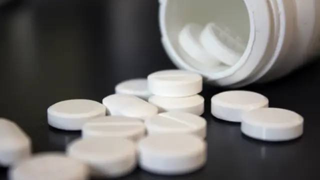 A spilled jar of pills