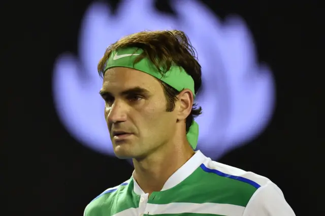 Roger Federer looks on