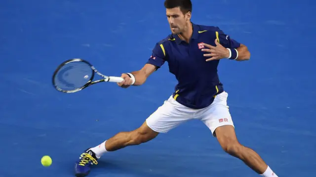 Novak Djokovic hits a forehand