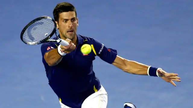 Novak Djokovic hits a return