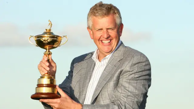 Colin Montgomerie holds aloft the Ryder Cup