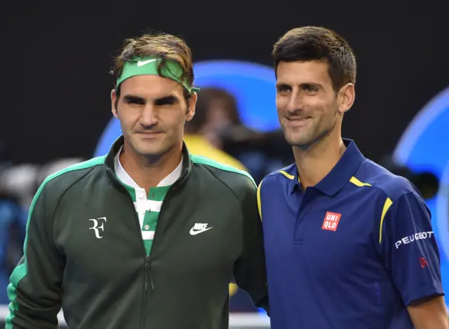 Roger Federer poses ahead of his men's singles semi-final match against Serbia's Novak Djokovic