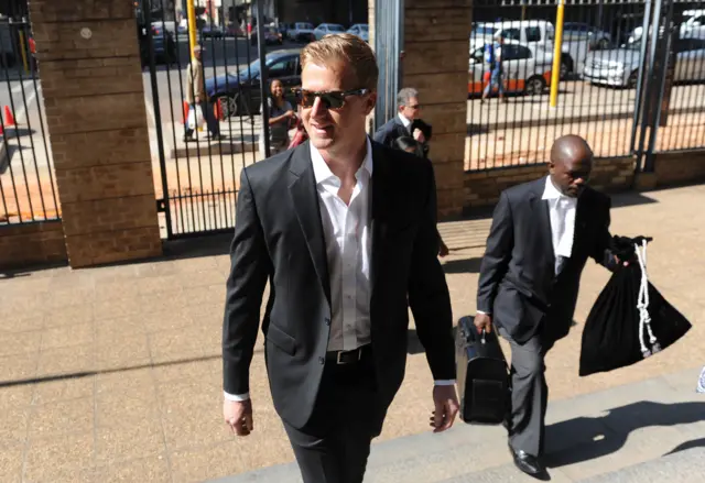 TV host Gareth Cliff arrives at the johannesburg high court for the ruling against his layoff on January 29, 2015 in Johannesburg.