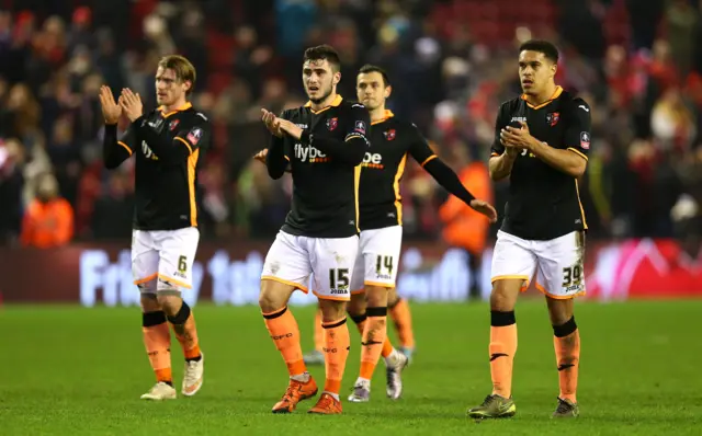 Exeter applaud their fans after the match with Liverpool