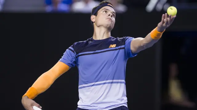 Milos Raonic prepares to serve