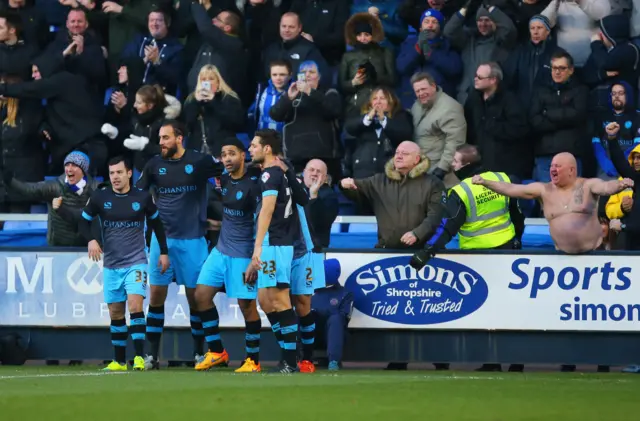 Lewis McGugan celebrates