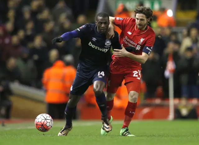 Liverpool's Joe Allen challenges for the ball