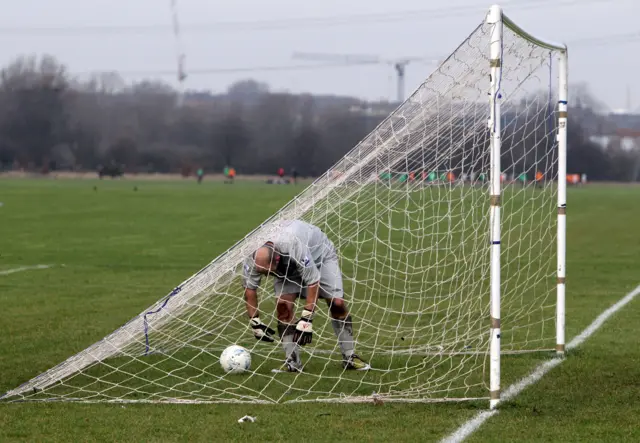 Goalkeeper lets in goal