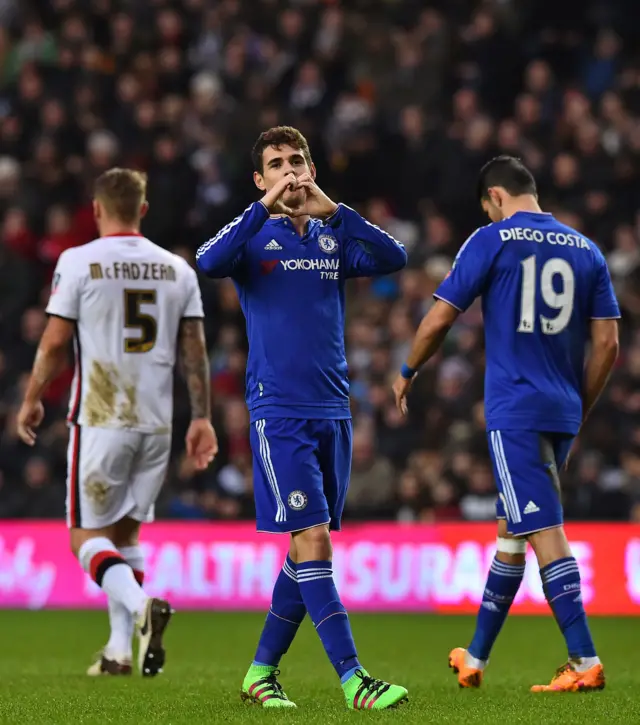 Chelsea"s Brazilian midfielder Oscar celebrates after scoring the opening goal of the English FA Cup fourth round football match between MK Dons and Chelsea at Stadium MK in Milton Keynes