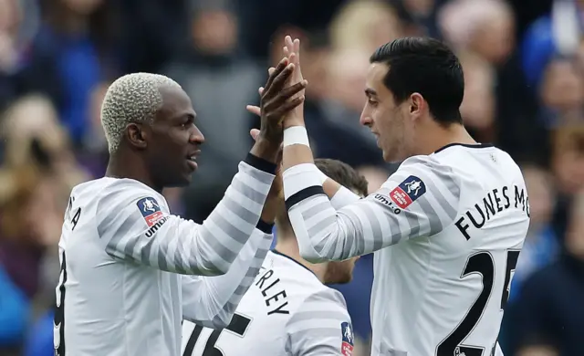 Arouna Kone celebrates scoring the first goal for Everton with Ramiro Funes Mori