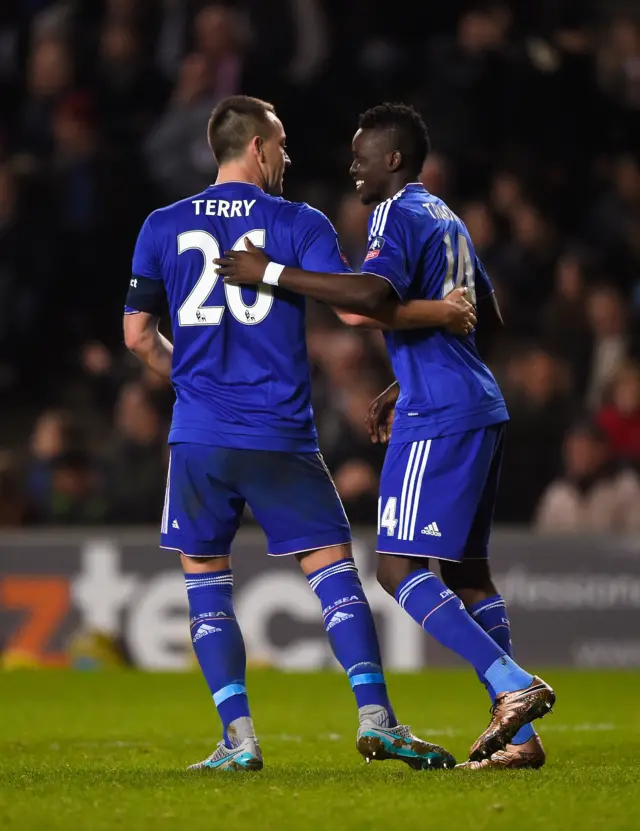 Bertrand Traore of Chelsea celebrates scoring his team"s fifth goal with John Terry during the Emirates FA Cup Fourth Round match between Milton Keynes Dons and Chelsea at Stadium MK