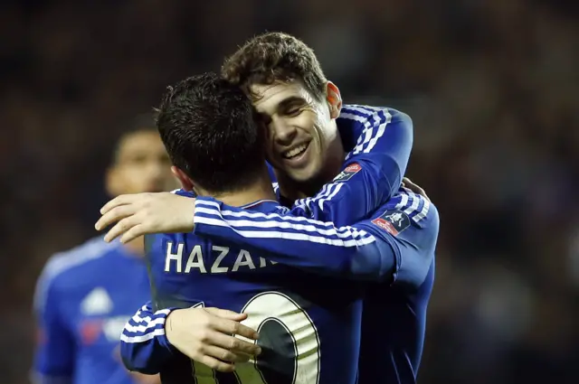 Oscar celebrates with Eden Hazard after scoring the third goal for Chelsea