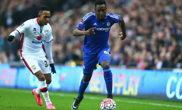 Baba Rahman of Chelsea takes on Rob Hall of MK Dons during the Emirates FA Cup Fourth Round match between Milton Keynes Dons and Chelsea at Stadium mk