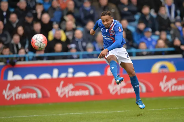 Carlisle United"s Ghanaian striker Derek Asamoah strikes the ball during the English FA Cup fourth round football match between Carlisle United and Everton at Brunton Park