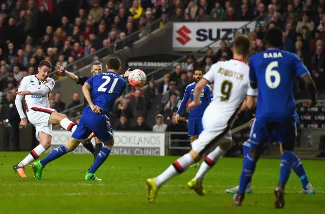 Darren Potter of MK Dons scores his team"s opening goal during the Emirates FA Cup Fourth Round match between Milton Keynes Dons and Chelsea