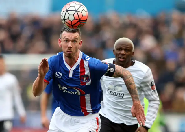 Carlisle United"s Michael Raynes, left, vies for the ball with Everton"s Arouna Kone during the English FA Cup fourth round soccer match between Carlisle United and Everton at Brunton Park