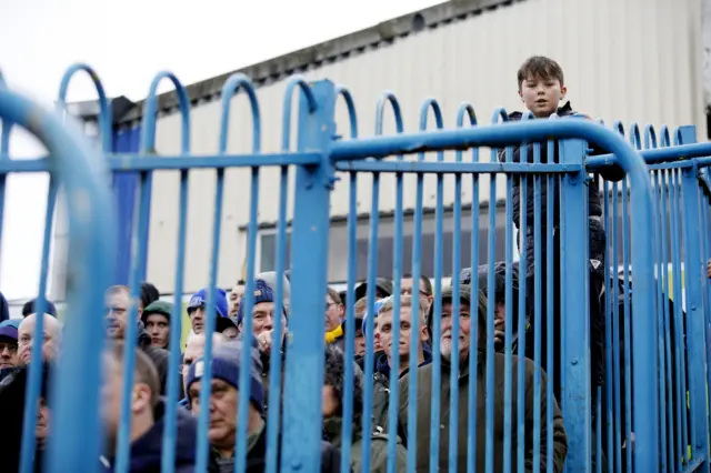 Fans watch the match