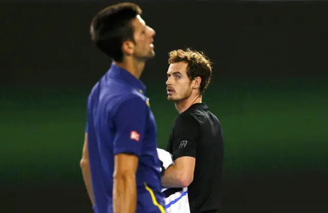 Andy Murray looks at Novak Djokovic