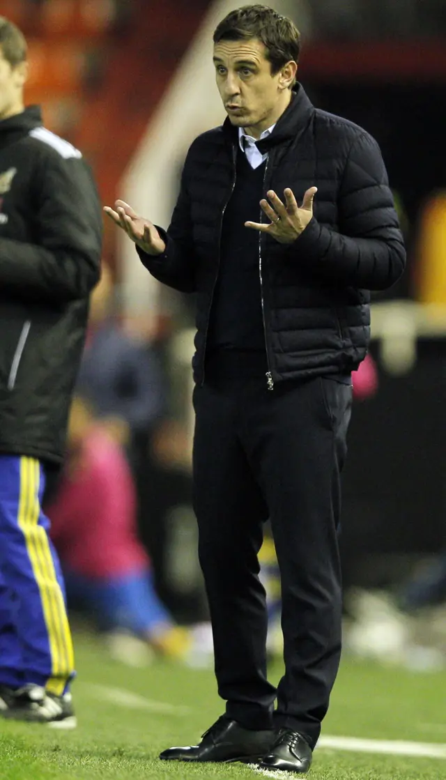 Valencia"s British coach Gary Neville gestures on the sideline