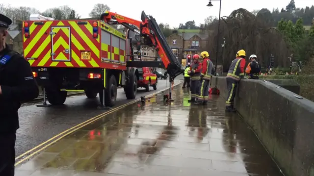 Fire service at bridge on the River Derwent