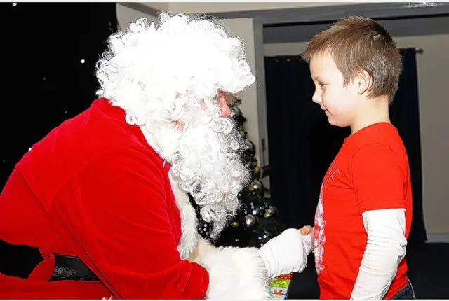 Santa speaking to child