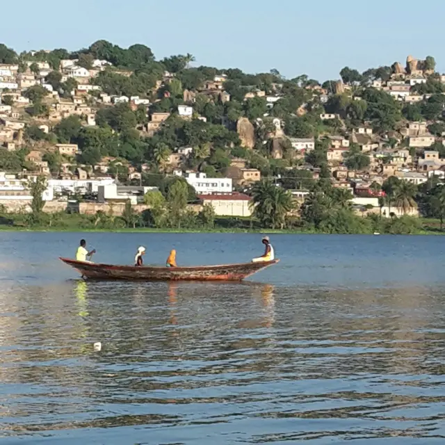 people on a canoe in Tanzania's Mwanza city