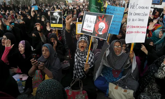 Shia Muslims chant slogans as they hold signs for Sheikh Nimr al-Nimr, who was executed along with others in Saudi Arabia, during a protest rally in Karachi, Pakistan, January 3, 2016