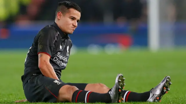 Philippe Coutinho sits injured on the floor