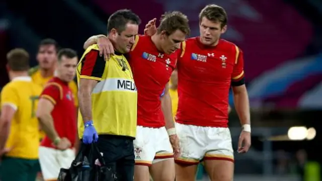 Liam Williams is helped from the field