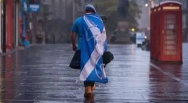 Lone independence supporter walking in Edinburgh