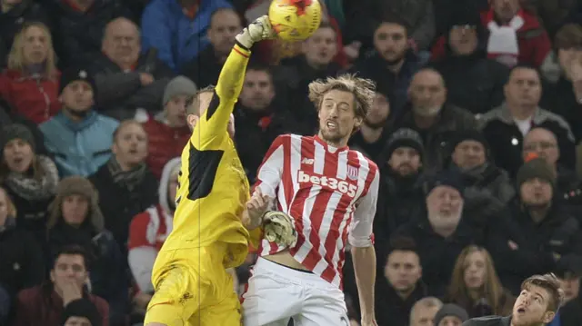 Peter Crouch jumps for the ball