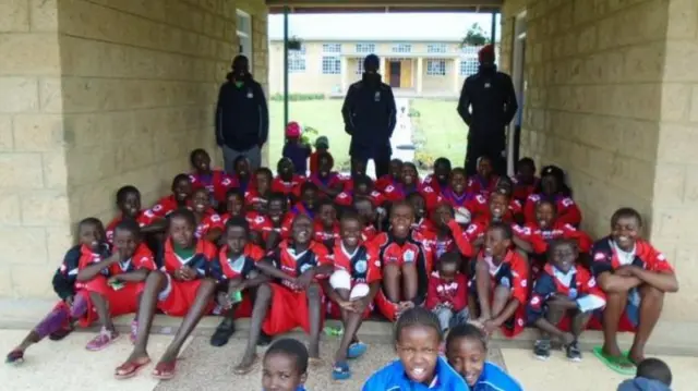 School in football kit