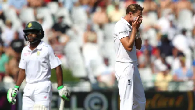 Stuart Broad reacts to a dropped catch