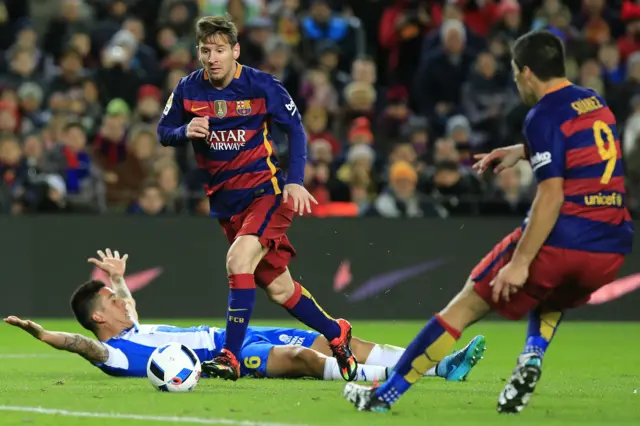 Lionel Messi drives towards goal