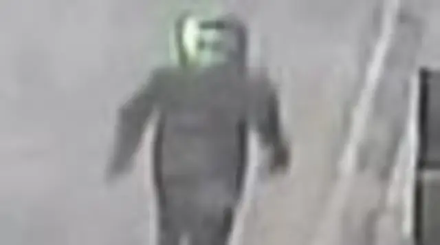 Suspect 1 wearing dark motorbike clothing