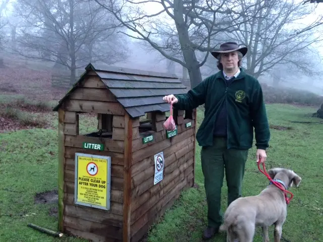 Peter Tyldesley putting dog poo bag in the bin