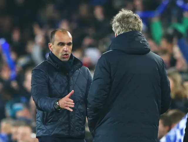 Roberto Martinez shakes Manuel Pellegrini's hand