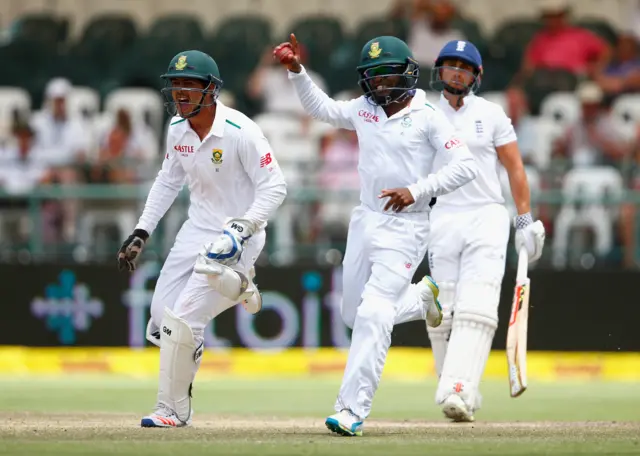 Quinton De Kock and Temba Bavuma celebrate the wicket of James Taylor