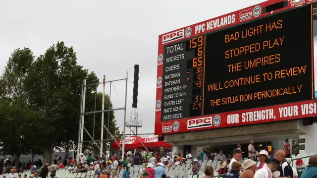 The scoreboard shows bad light has stopped play