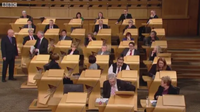 The chamber with Scottish Labour MSP James Kelly being thrown out in a row over trade union rights