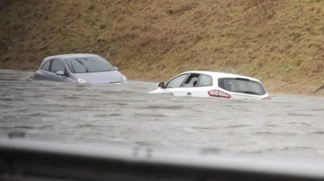 Cars caught in flooding