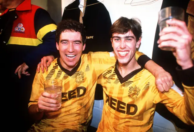 Sutton United's Tony Rains and Matthew Hanlan celebrate after beating Coventry