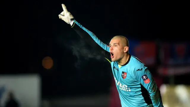 Robert Olejnik of Exeter City instructs