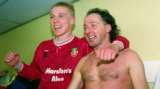 Mickey Thomas (left) celebrates after Wrexham beat Arsenal