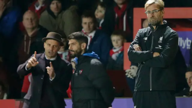 Liverpool manager Juergen Klopp and Exeter City manager Paul Tisdale