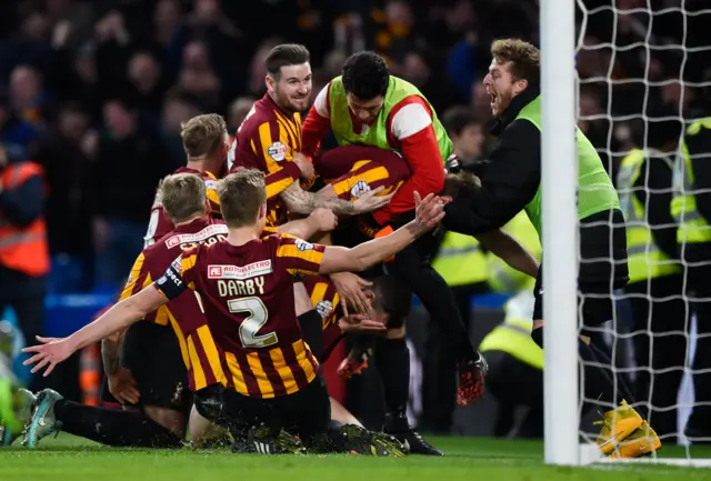 Bradford players celebrate victory at Chelsea