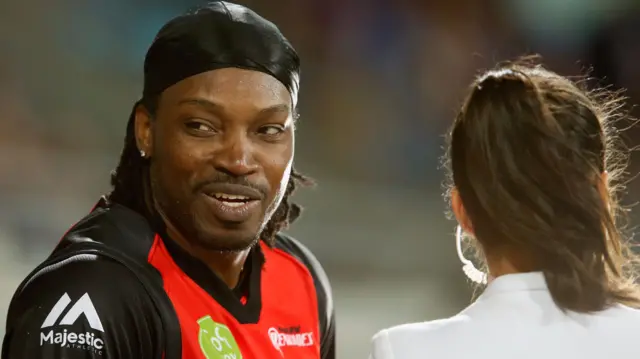 Chris Gayle of the Melbourne Renegades gives a TV interview to Mel Mclaughlin